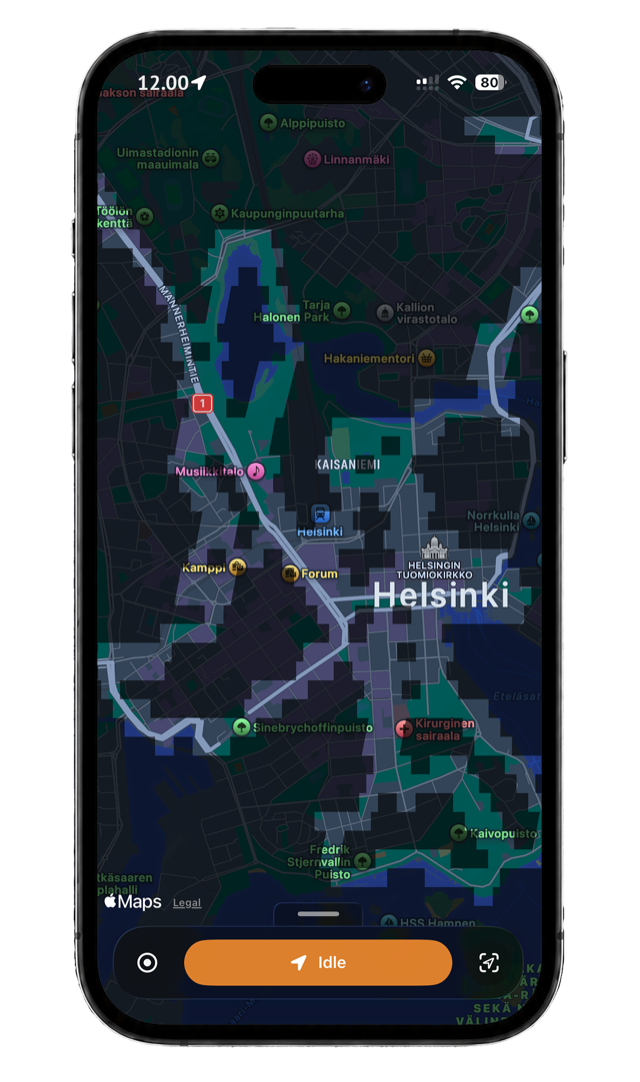 FogMap on iPhone revealing walked streets across Helsinki as a grid of uncovered map cells, with unexplored areas still hidden under fog